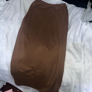 Super stretchy waist band not loose though. Brown size small skirt